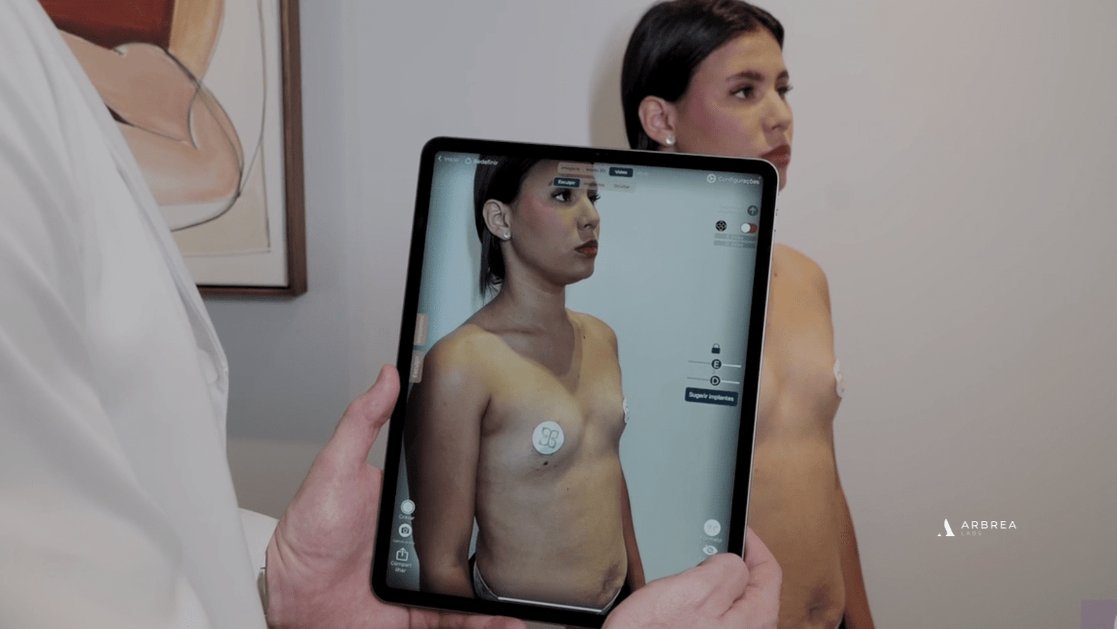 Doctor showing a patient her simulation on an iPad